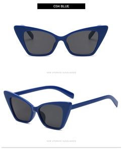 Detail view of stylish C04 blue cat eye sunglasses with thick frames and dark lenses
