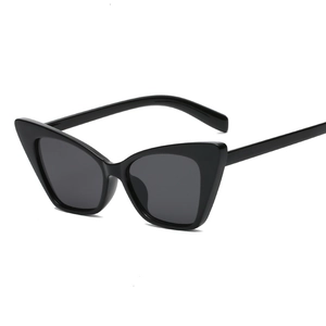 Fashionable black cat-eye sunglasses with dark grey lenses in a retro 45-degree side view