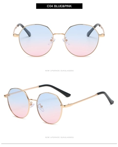 Detail of rose gold polygonal sunglasses with blue and pink gradient lenses