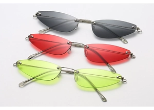 Detail of rimless triangle cat-eye sunglasses with metal bridge in multiple color lenses