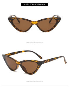 Détail de lunettes de soleil œil de chat léopard avec verres bruns et marquage C03