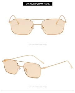 Détail de lunettes de soleil carrées en métal doré avec verres de couleur champagne