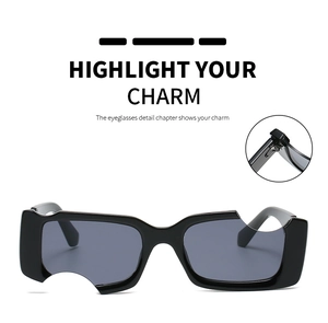 Détail des lunettes de soleil noires rectangulaires avec découpes avant-gardistes