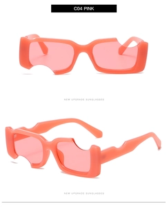 Vue détaillée des lunettes de soleil roses carrées avec monture épaisse irrégulière