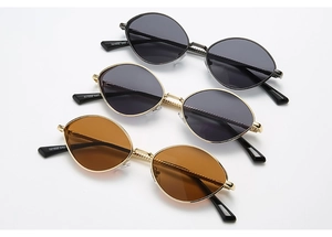 Détails de lunettes de soleil ovales vintage avec montures métalliques texturées et verres