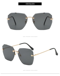 Détail de lunettes de soleil sans monture à verres découpés et charnières dorées