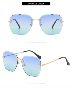 Détail de lunettes de soleil sans monture dégradé bleu-vert avec branches dorées