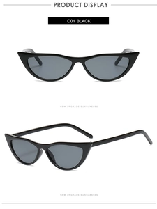 Close-up of black retro cat-eye sunglasses with dark grey UV protective lenses