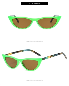 Detail view of fluorescent green cat-eye sunglasses featuring colorful marble pattern temples