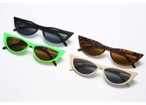 Close-up of retro cat eye sunglasses in black, green, tortoiseshell and cream finishes