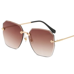Lunettes de soleil sans monture à dégradé avec branches en métal à texture tressée dorée
