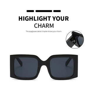 Detail view of reinforced metal hinges and wide frame for square fashion sunglasses