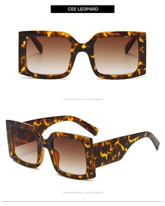 Detail of square leopard print sunglasses with gradient brown lenses and thick frames