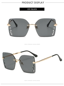 Detail of square oversized sunglasses with silver rhinestones and wave metal design