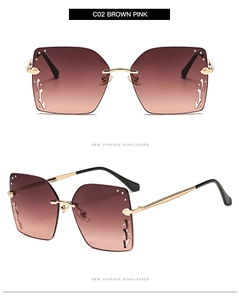 Detail of square oversized sunglasses with brown pink gradient lenses and side rhinestone accents