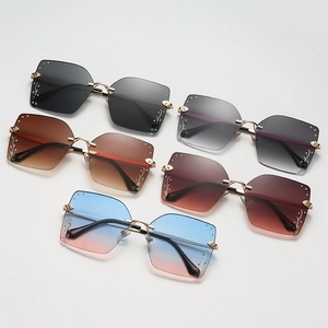 Fashion oversized square rimless sunglasses with gold metal temples and diamond accents