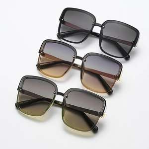 Three pairs of oversized square metal sunglasses with colorful gradient lenses on white backdrop
