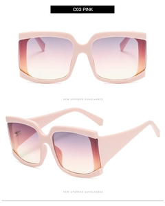 Détail de lunettes de soleil carrées roses avec verres dégradés violets à oranges