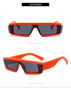 Detail of bright orange rectangular sunglasses with thick frames and dark lenses