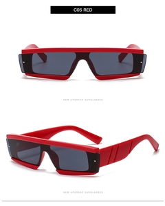 Detail view of red oversized square sunglasses with thick temples and metal rivets