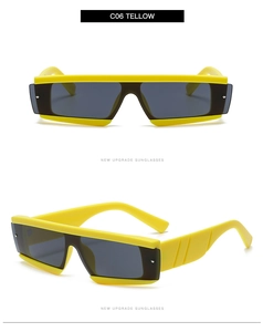 Detailed front and side view of yellow bold rectangular sunglasses with metal rivets