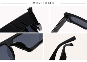 Detail view of large black square sunglasses showing frame texture and hinge design