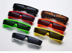 Flat lay of multiple colorful rectangular sunglasses in black, leopard, red and white
