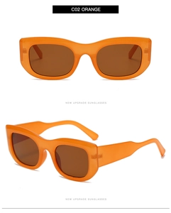 Detail view of orange rectangle sunglasses with thick temples and dark brown lenses