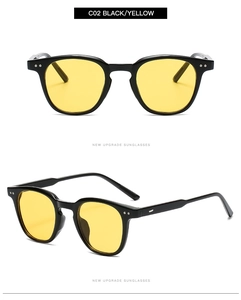 Détails de lunettes de soleil rondes vintage, monture noire avec des verres jaunes