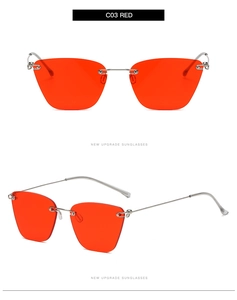 Close-up of frameless cat-eye sunglasses with red lenses and silver metal temples