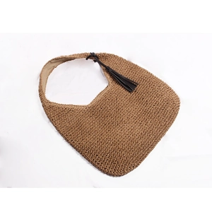 Large straw shoulder bag with black tassel detail in U-shaped woven design for beach vacations