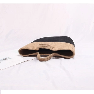 Handmade bicolor straw beach tote bag with integrated round handles and woven pattern