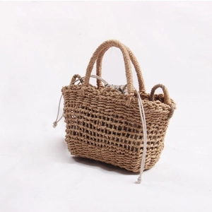 Handmade hollow straw handbag with drawstring lining for women's summer beach vacation