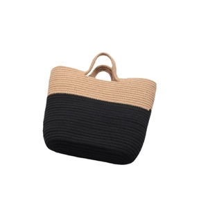 Fashionable bicolor woven straw tote bag with black contrast bottom and top handles