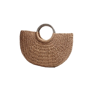 Handmade semi-circular straw tote bag with black and white striped round handles