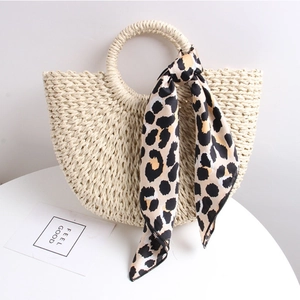 Handmade beige semi-circle straw beach bag with leopard scarf and round ring handles