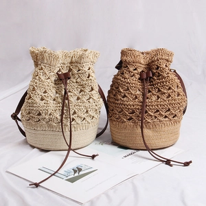 Women Hollow Flower Straw Woven Bucket Bag Handmade Bohemian Beach Shoulder Bag With Synthetic Leather Drawstring Closure