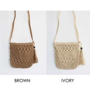 Comparison of brown and ivory hollow knit crossbody bags with tassels and wood beads