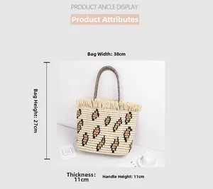 Detail view of woven straw tote bag with leopard pattern and dimensions 38x27x11cm