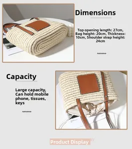 Detail view of woven straw tote bag showing dimensions 27x20x10cm and brown leather strap
