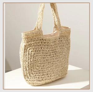 Detail shot of beige hand-woven straw tote bag texture and spacious light lining