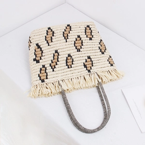 Bohemian straw tote bag with leopard print patterns and fringe trim for beach vacations