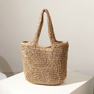 Handwoven beige straw tote bag with zipper closure for summer beach vacations