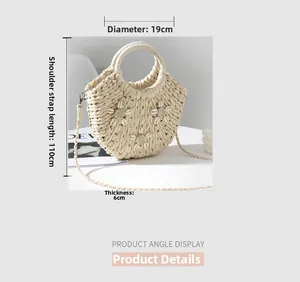 Dettaglio borsa intrecciata con fiori di conchiglia, diametro 19cm e tracolla 110cm