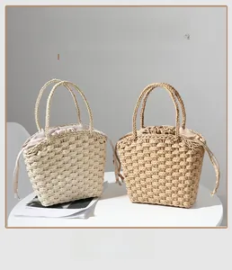 Detailed straw weave texture and drawstring closure on minimalist summer tote bags