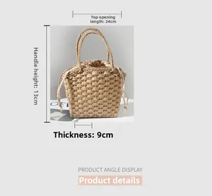 Straw handbag detail with woven texture and beige drawstring inner lining