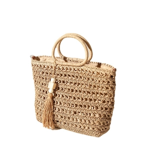 Handmade woven straw tote bag with tassel charms and wooden beads for summer beach vacations