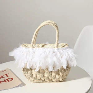 Chic woven straw handbag with white feather trim for beach vacations and holiday fashion