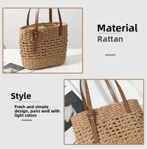 Detail of hollow-out raffia woven bag with brown leather strap and drawstring lining