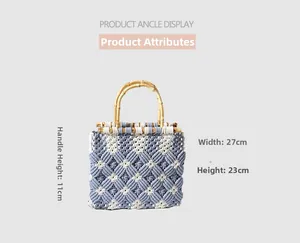 Detail of hand-woven cotton rope bag with blue diamond pattern and bamboo handle